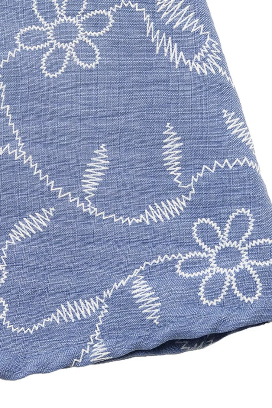Maxi dress with white floral embroidery on blue textured fabric