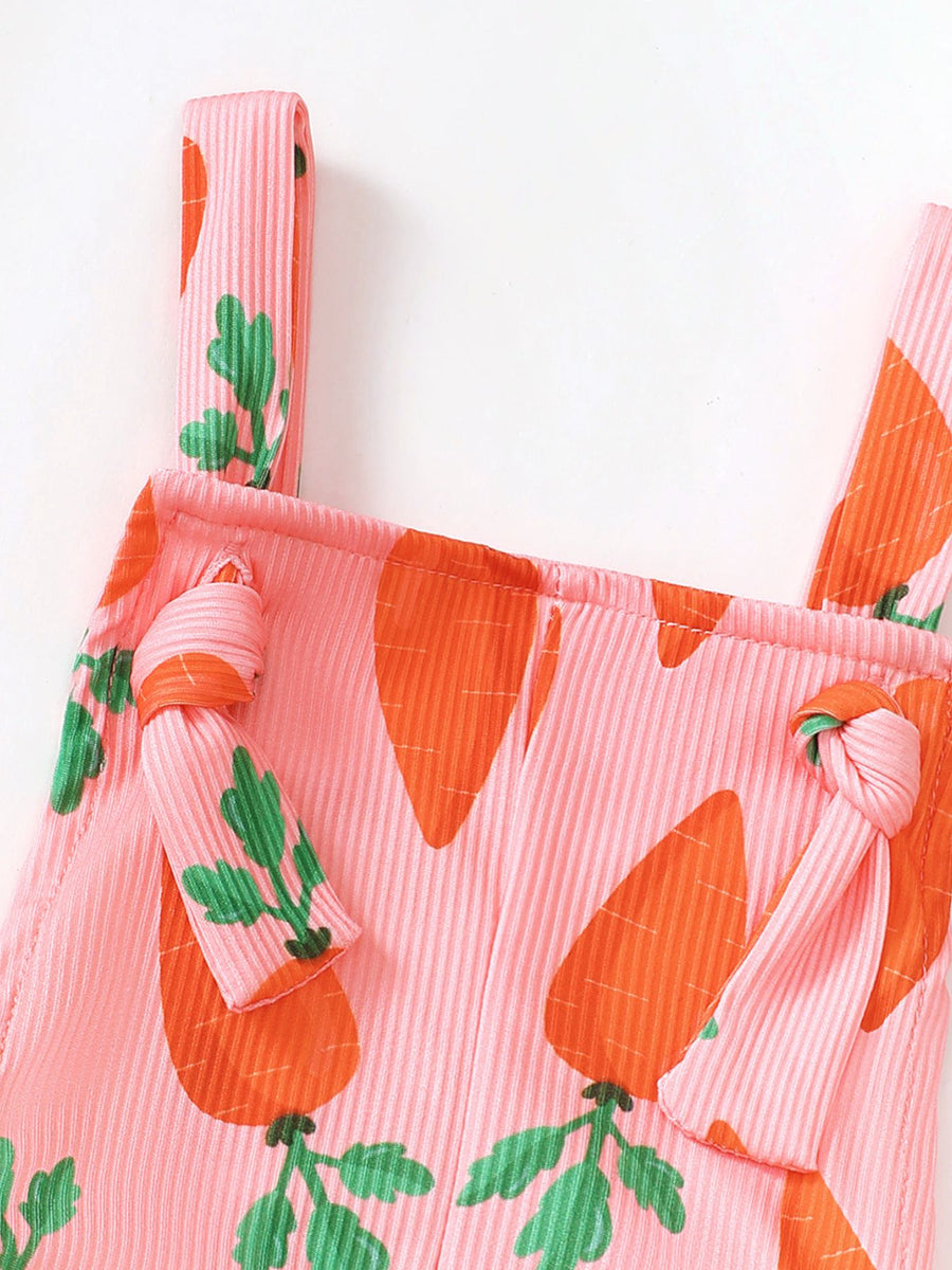 Pink ribbed overalls with carrot print and knot shoulder straps.