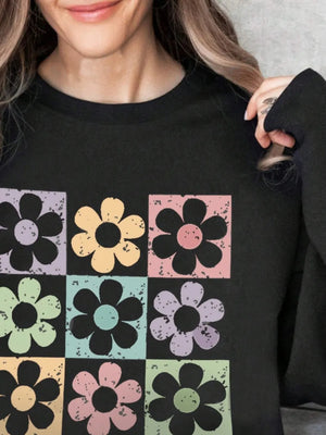 Black sweatshirt with a retro floral square print in pastel colors.
