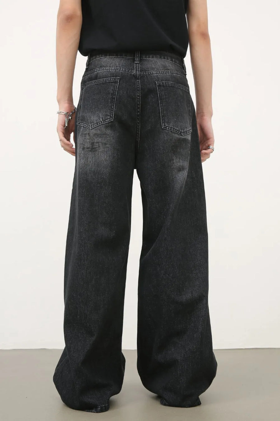 Oversized charcoal wash denim jeans with a wide leg and relaxed fit.