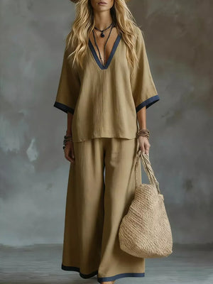 Camel V-neck two-piece set with contrast trim and wide leg pants.