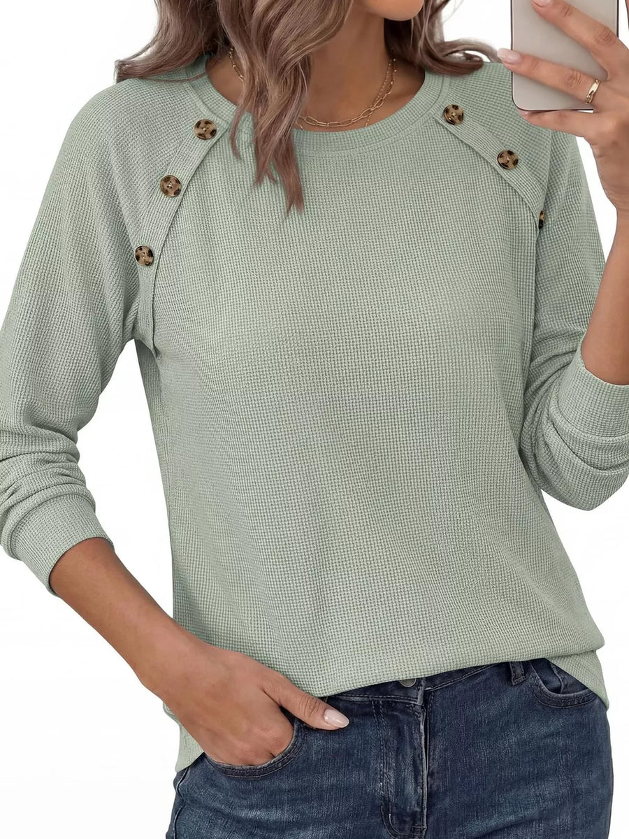 ivory t-shirt with decorative buttons and long sleeve