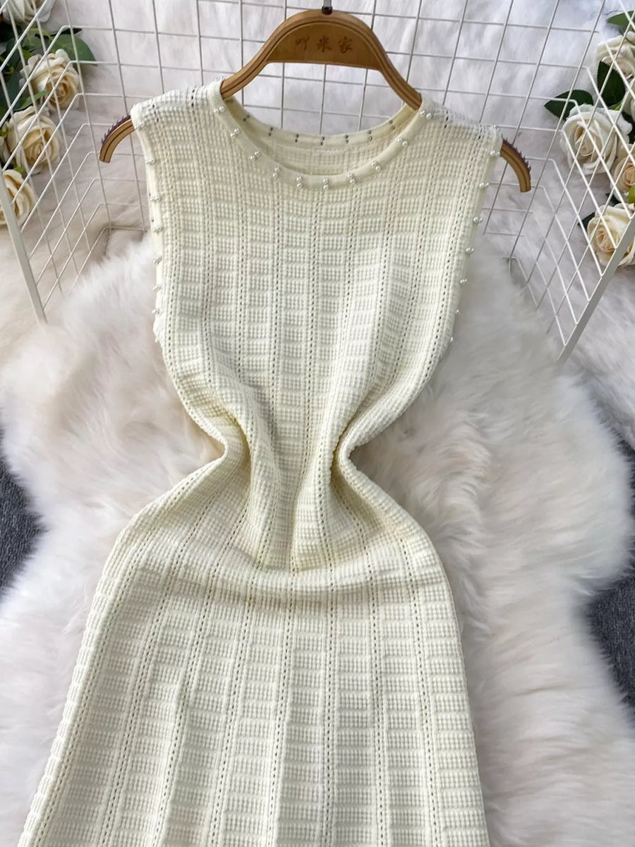 White knit midi dress with pearl neckline detail and textured pattern