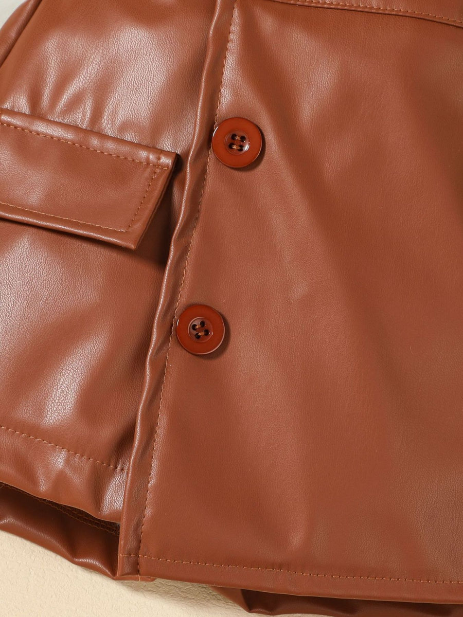 Brown faux leather baby skirt with button detail and pocket.