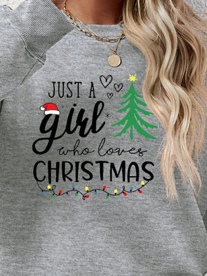Grey crewneck sweatshirt with "Just a girl who loves Christmas" graphic and Christmas lights.