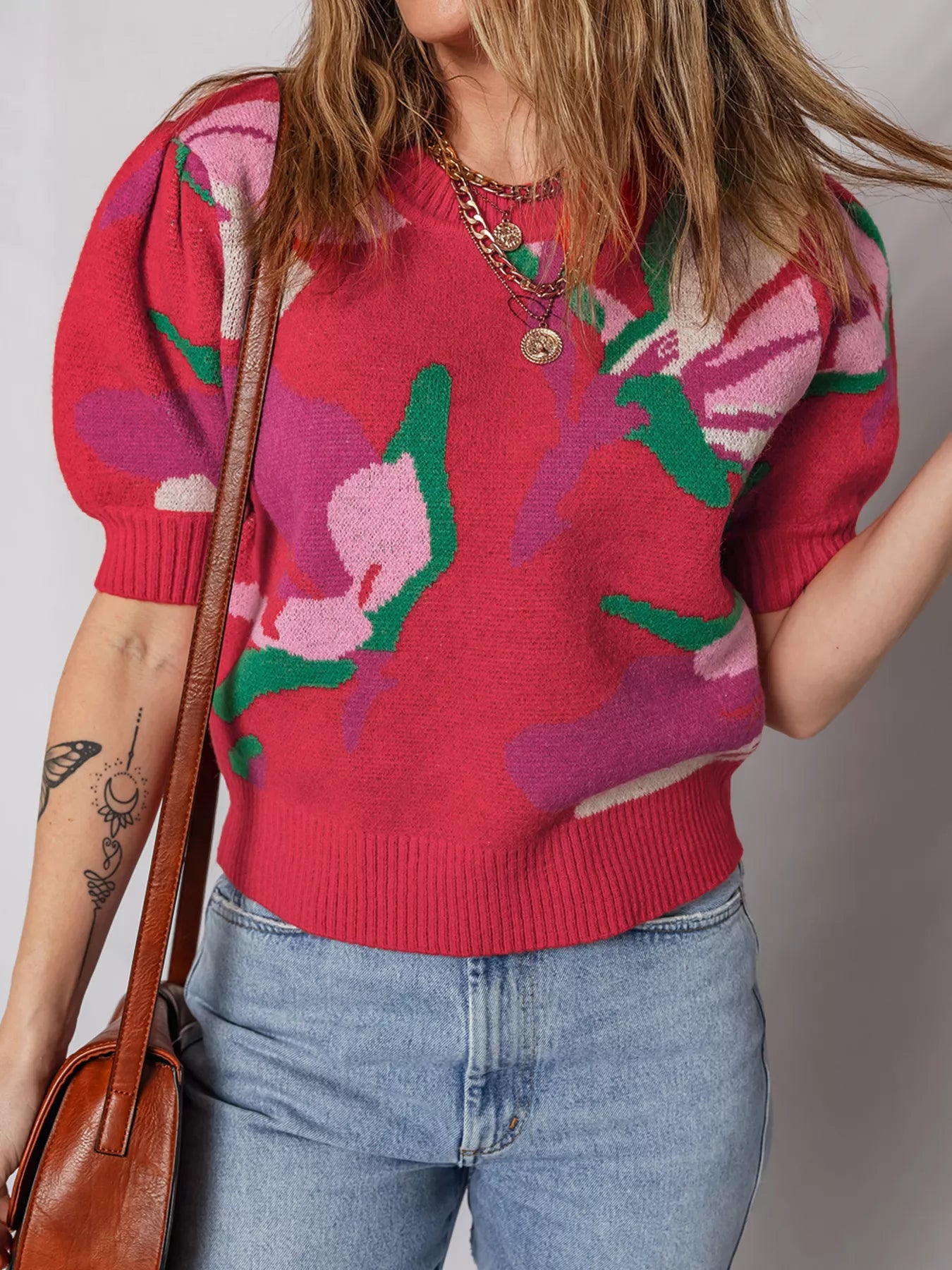 Scarlet abstract floral puff sleeve sweater with crew neck and ribbed hem.