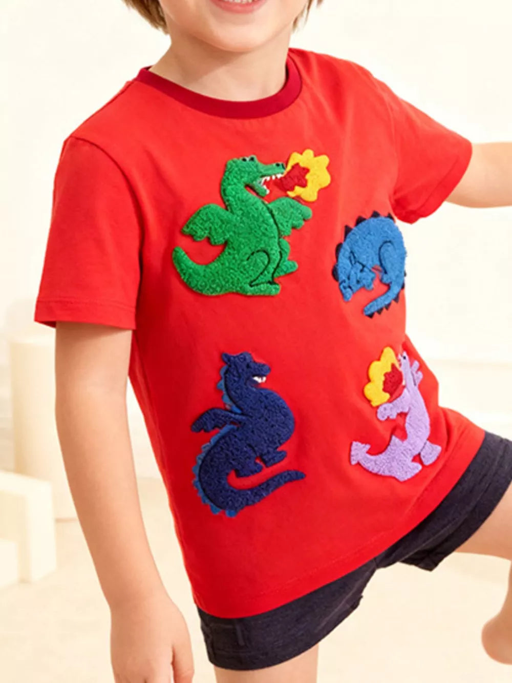 Red cotton t-shirt with colorful dinosaur appliques for toddlers