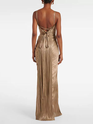 Gold metallic corset maxi gown with lace-up back and pleated skirt.