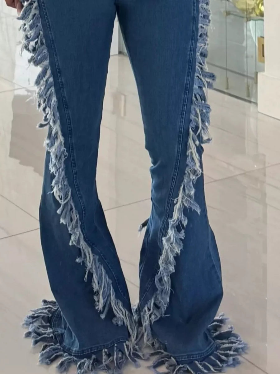 Blue high-waist flare jeans with deconstructed frayed hem and side fringe detail.