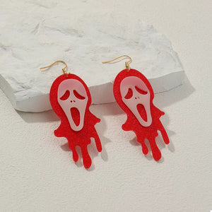 pale pink earrings featuring dangle and graphic