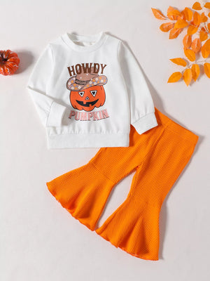 white sweatshirt and pants set with graphic print and crew neck
