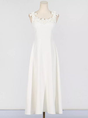 White sleeveless maxi dress with floral applique neckline