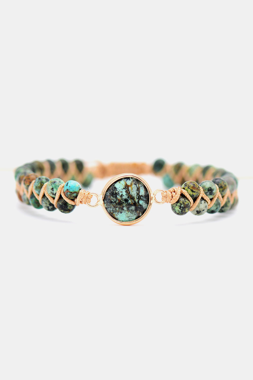 Turquoise beaded bracelet with braided cord and a central turquoise stone accent.