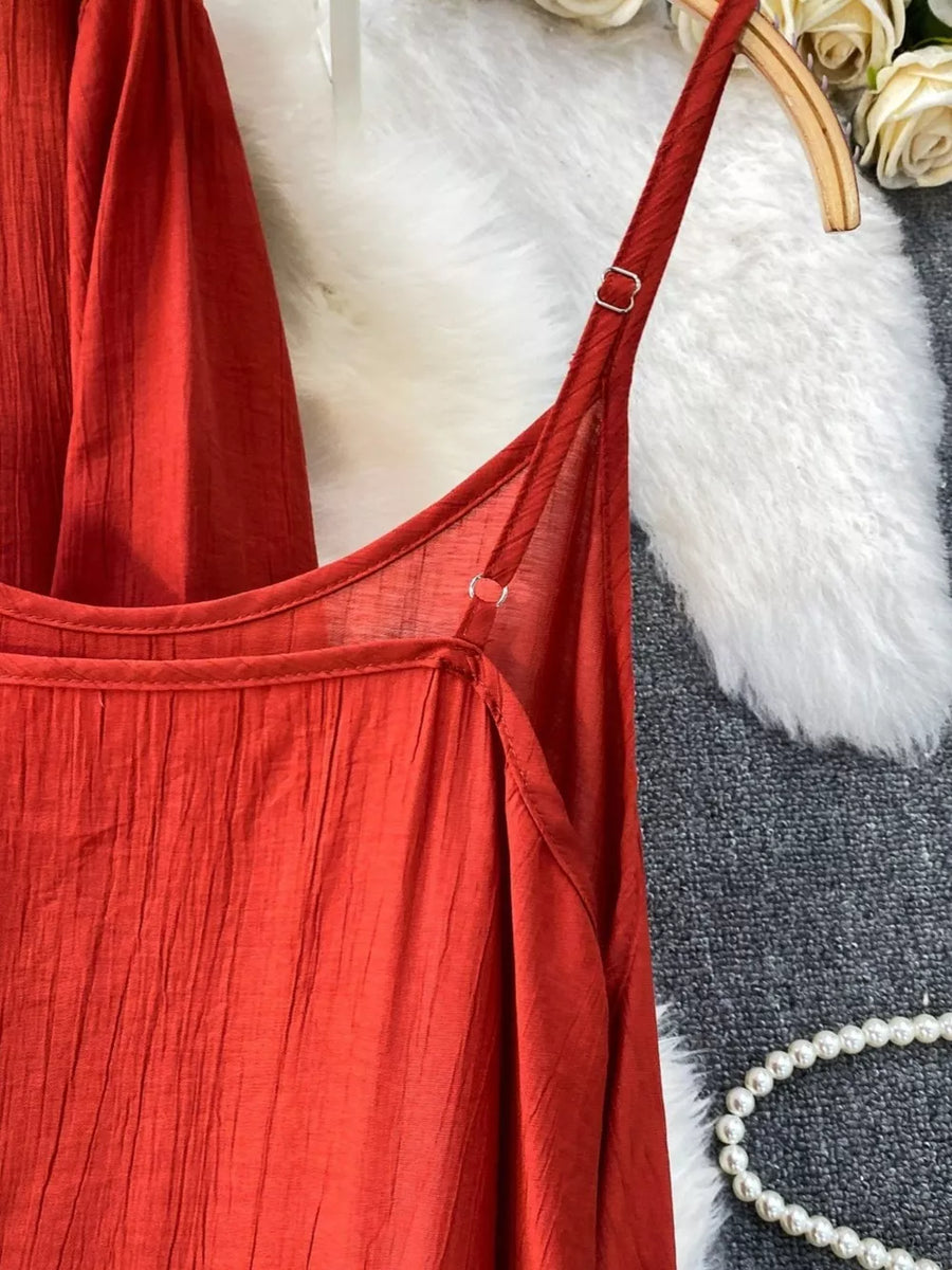 Red cami top with adjustable straps and crinkled texture detail