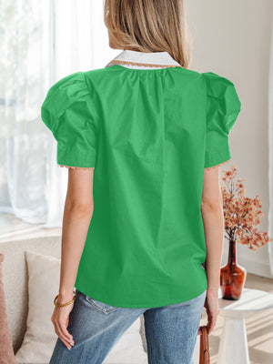 Green cotton blouse with puff sleeves, white collar, and ricrac trim.