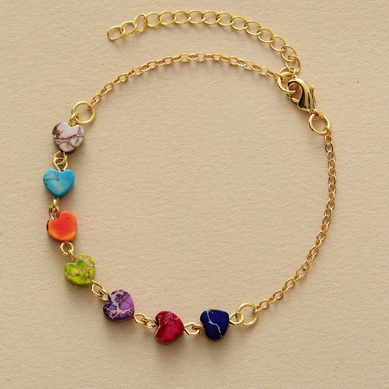 Multicolor heart stone bracelet with gold chain and clasp.