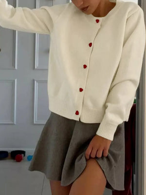 Cream long sleeve cardigan with red heart buttons and ribbed cuffs