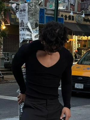 Black ribbed knit long sleeve top with a deep keyhole cutout neckline.