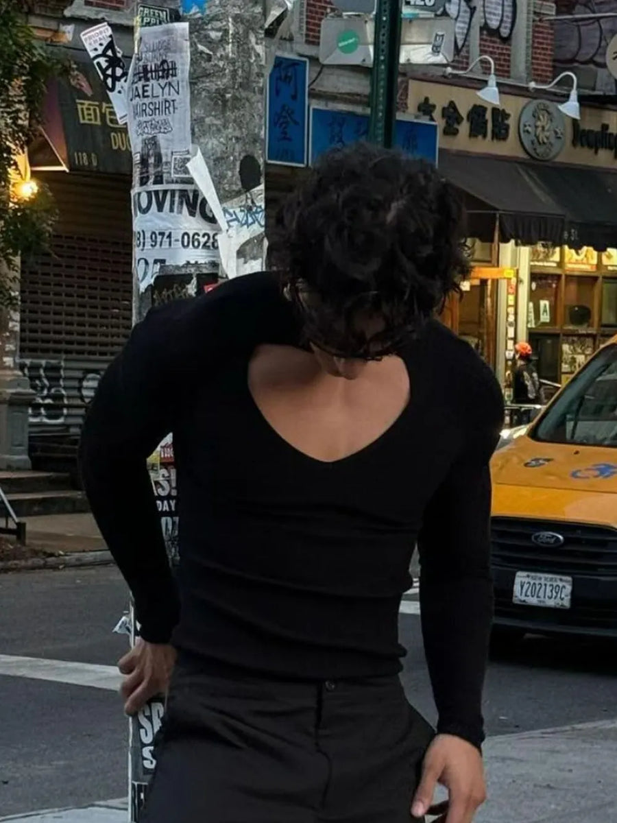 Black ribbed knit long sleeve top with a deep keyhole cutout neckline.