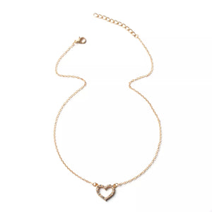 Gold heart pendant necklace with clear stones on a delicate chain