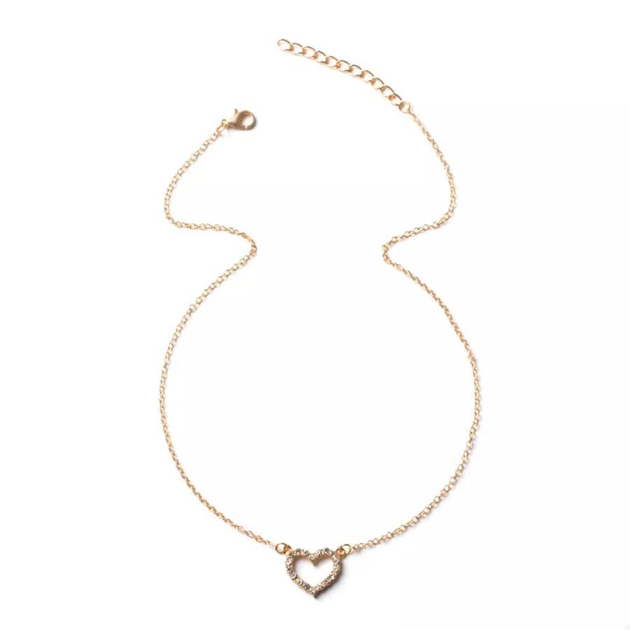 Gold heart pendant necklace with clear stones on a delicate chain