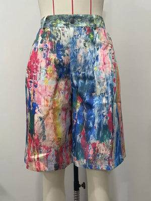 Bermuda shorts with abstract paint splatter print in multicolor, high-waisted with button closure.