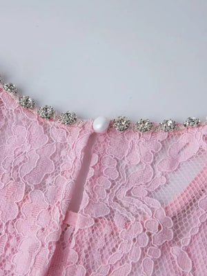 Pink lace midi dress with pearl and rhinestone neckline detail