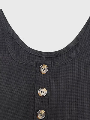 Textured knit black jumpsuit with button front detail and scoop neckline.