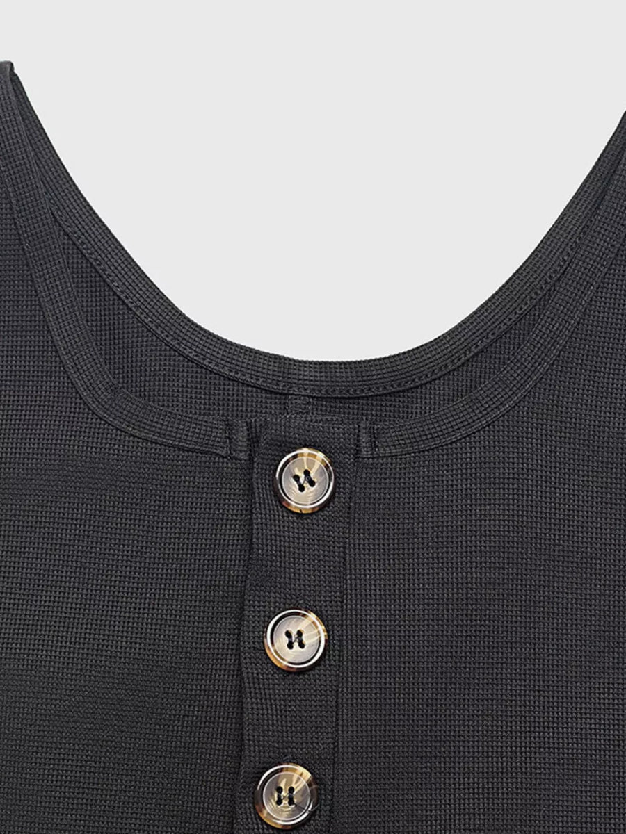 Textured knit black jumpsuit with button front detail and scoop neckline.