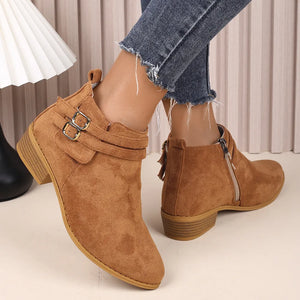 Buckle detail suede ankle booties in ochre with side zipper and low heel.