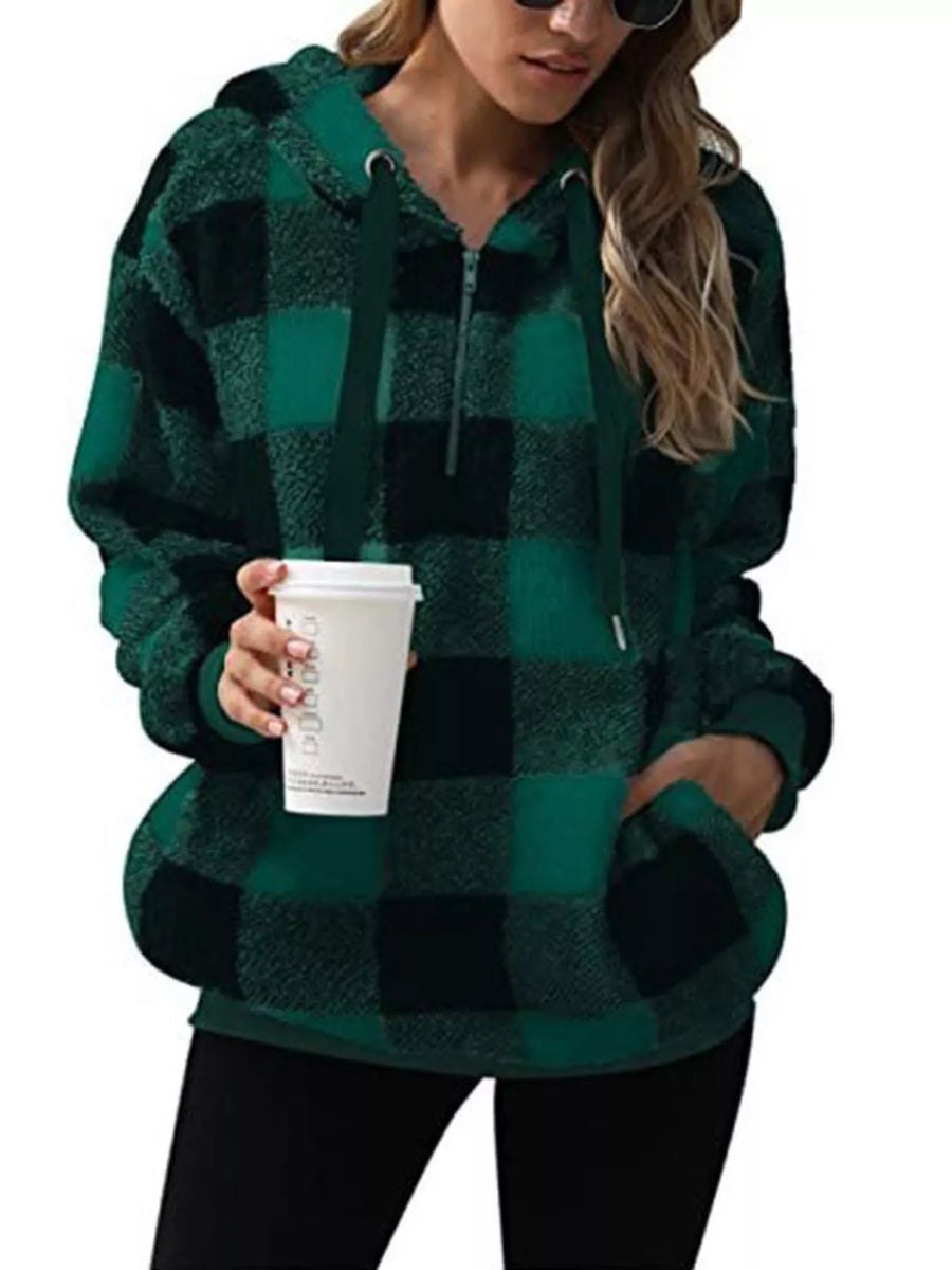 Green plaid sherpa hoodie with drawstring and quarter zip, featuring a cozy fleece texture.