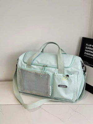 Light blue duffel bag with mesh pocket and front pockets