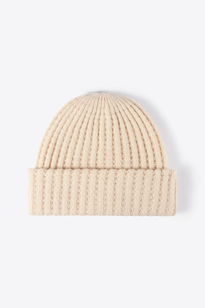 Beige ribbed knit beanie with textured detail