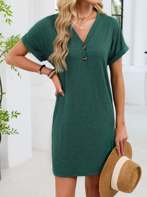 Dark green v-neck t-shirt dress with decorative buttons and cuffed short sleeves.