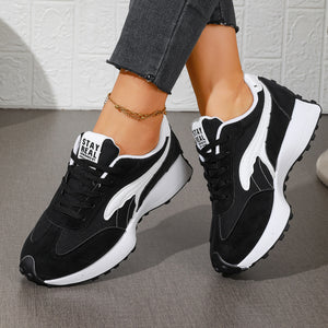 black sneakers featuring round toe and leopard-print