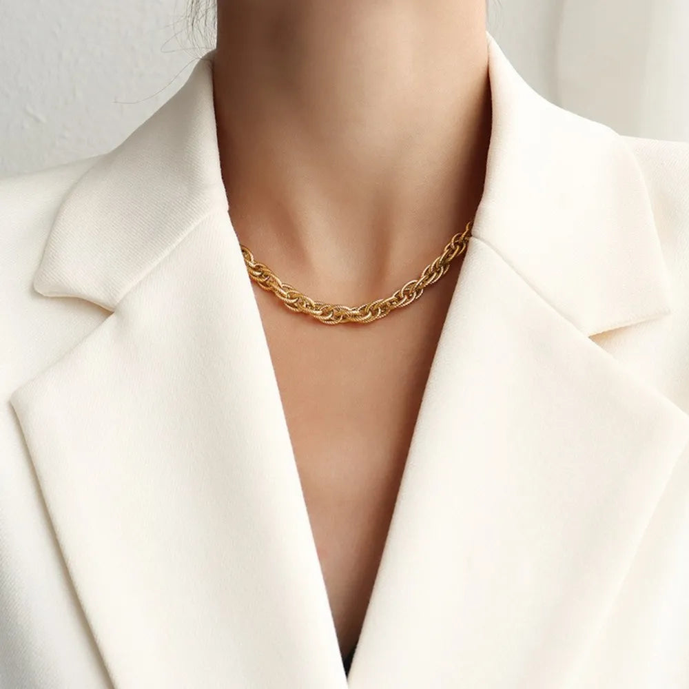 Gold textured rope chain necklace with interlocking links.