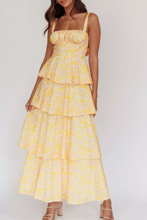 Yellow floral tiered maxi dress with square neckline and adjustable straps