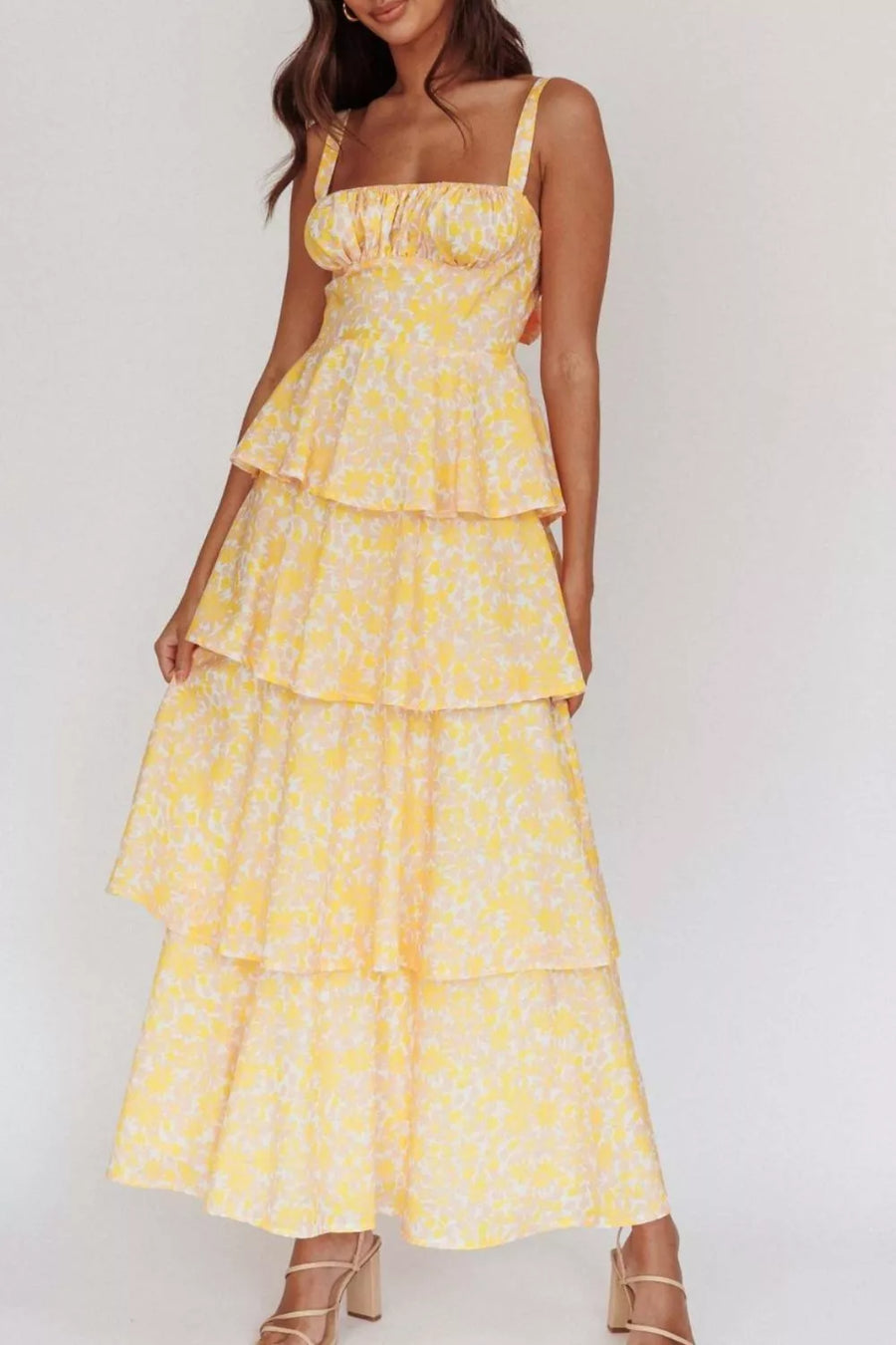 Yellow floral tiered maxi dress with square neckline and adjustable straps