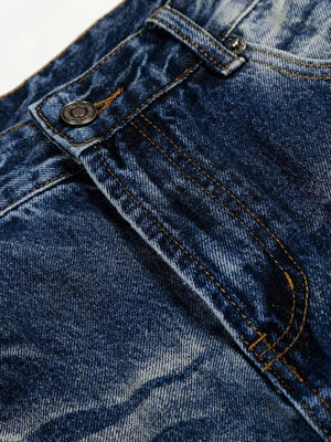 Men's light blue vintage wash wide leg jeans detail showing button and stitching