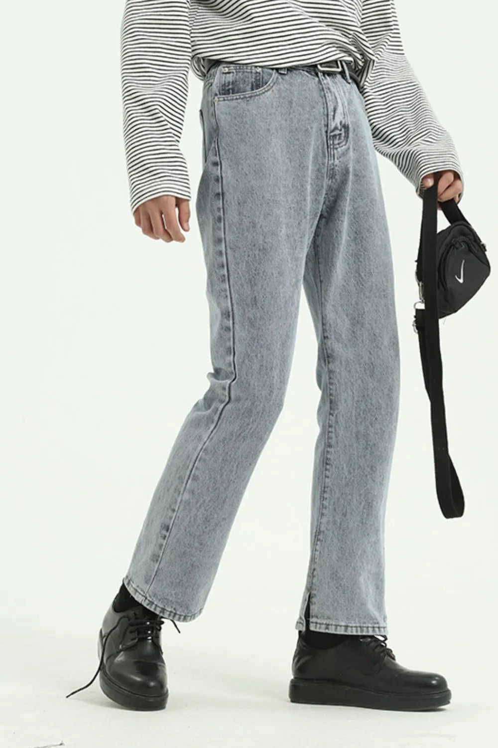 Split hem straight leg acid wash denim jeans in medium, with a casual chic style.