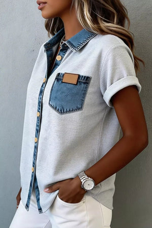 Light gray button-down overshirt with denim collar and pocket, cuffed short sleeves.