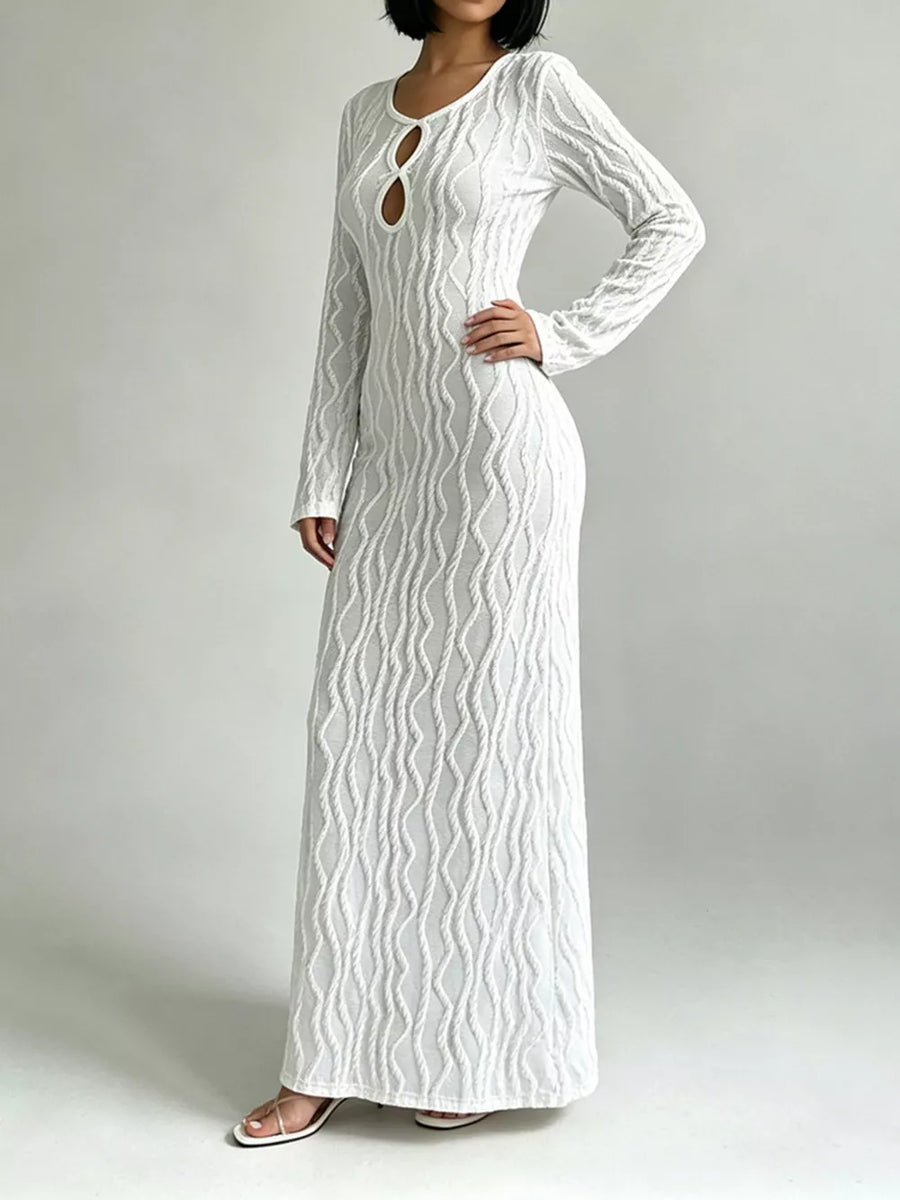 White long sleeve maxi dress with textured wavy pattern and keyhole cutout neckline.