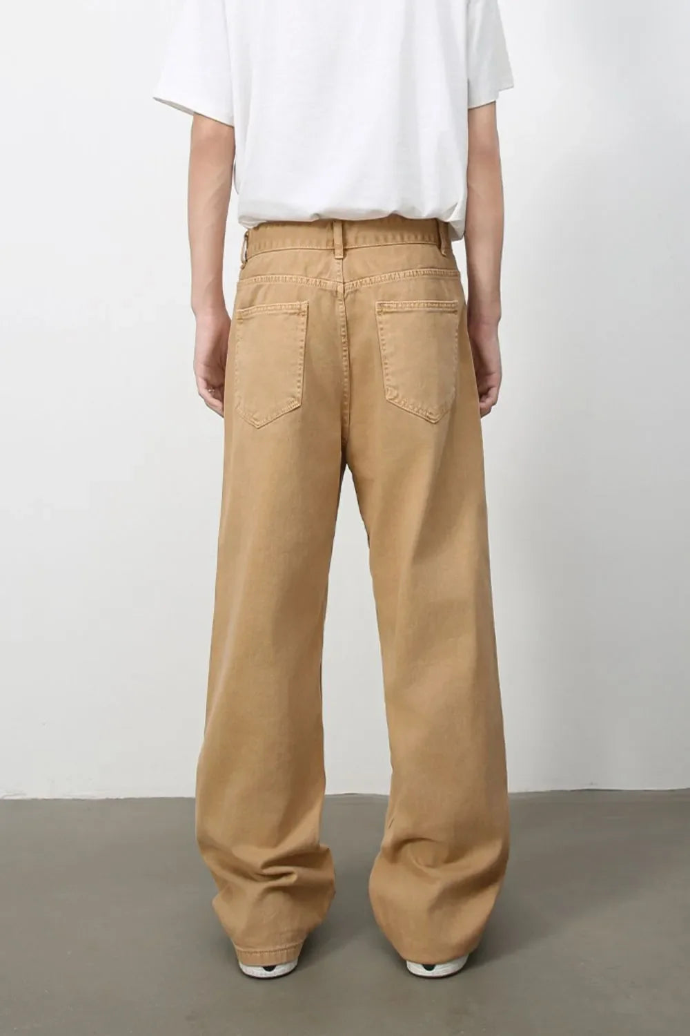 Wide-leg sandstone denim trousers with a casual, baggy fit and two back pockets.