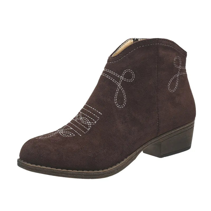 Embroidered suede western ankle boots in chocolate with white stitching detail.