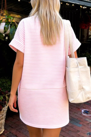 Pink striped mini dress with cuffed short sleeves and a relaxed fit.