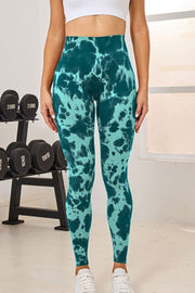 Teal ink blot high-waist sculpt leggings with a tie-dye pattern.