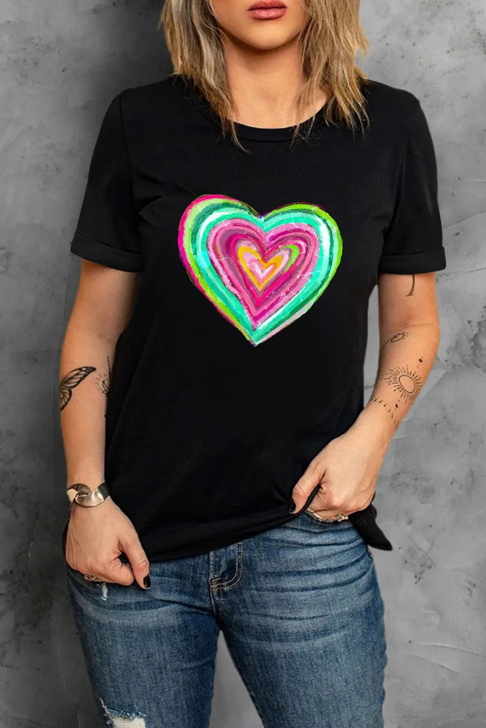 Black crew neck t-shirt with a colorful painted heart graphic.