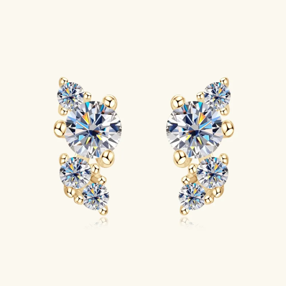 Gold celestial cluster diamond stud earrings with round-cut stones and gold bead accents.
