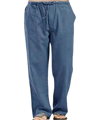 Relaxed linen drawstring trousers in dusty blue with a loose fit and pockets.