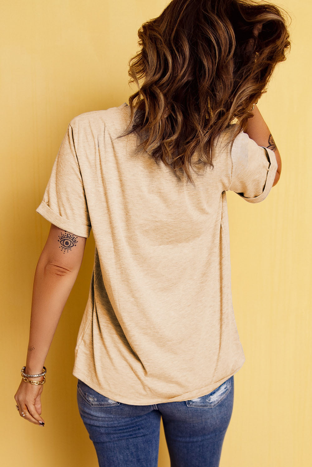 Sand graphic crop tee with rolled sleeves and a relaxed fit.